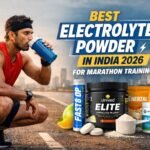 Indian marathon runner hydrating with electrolyte drink during long run training with electrolyte powder products displayed in background