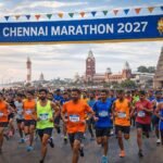 Chennai Marathon 2027 runners passing Marina Beach and Chennai Central with city landmarks in the background