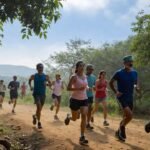 iverse group of Indian runners training on a scenic dirt trail in India for injury prevention and marathon preparation
