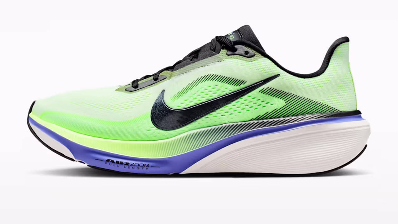 Nike Pegasus 42 in bright neon green with blue accents highlighting the new curved Air Zoom and ReactX foam