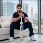 Sanju Samson fitness inspiration – Indian cricketer holding SG bat in modern home setting