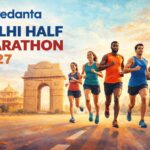 Vedanta Delhi Half Marathon 2027 runners near India Gate in New Delhi during sunrise race scene