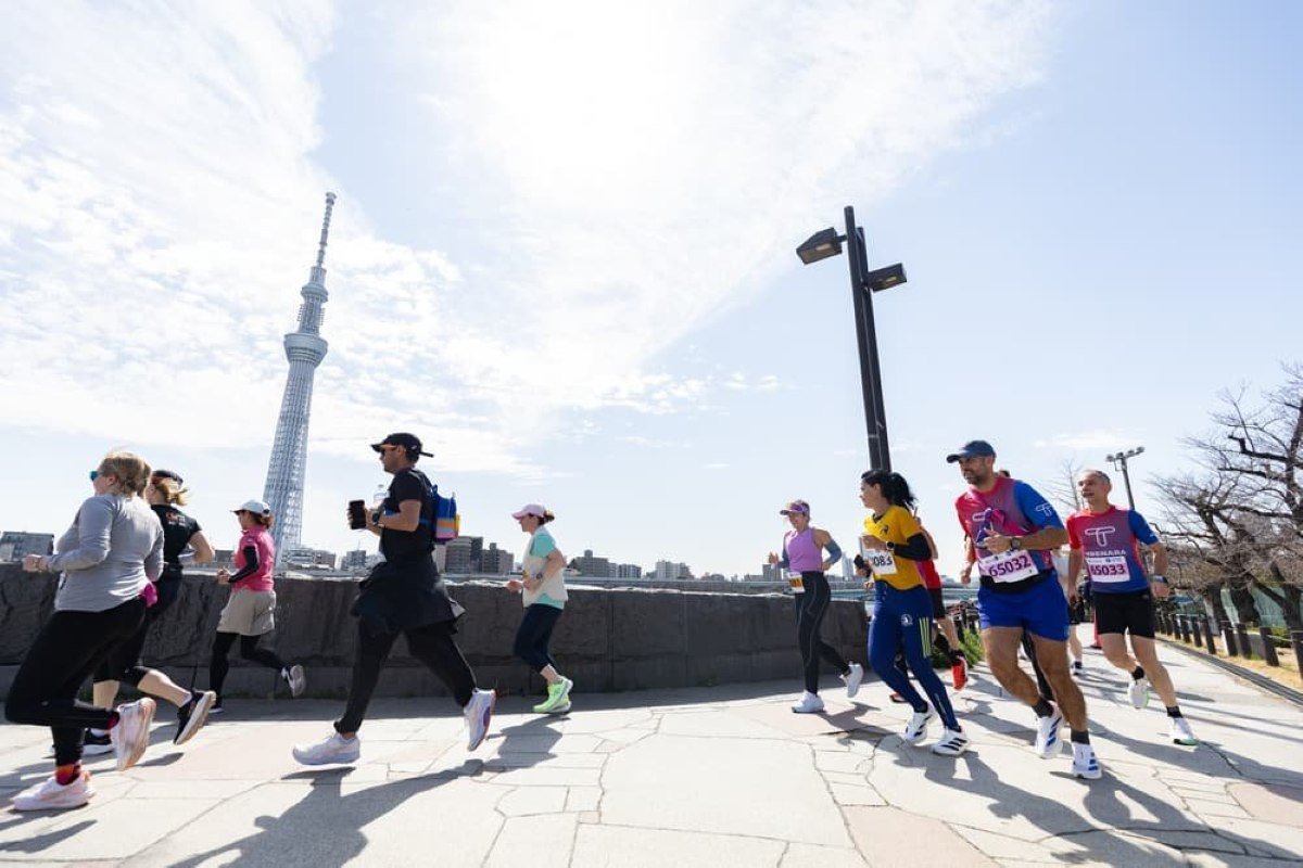 Runners passing the Tokyo Skytree during the Tokyo Marathon 2026 Friendship Run in Asakusa