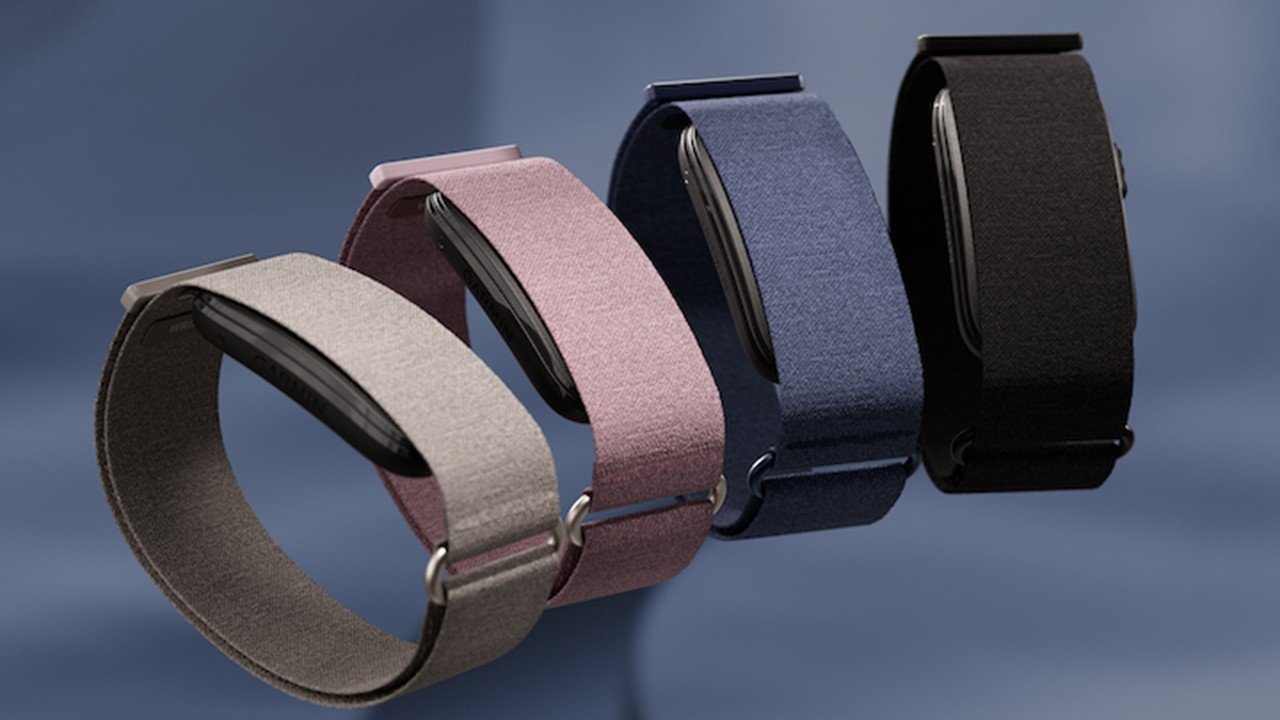 Garmin CIRQA Smart Band in four colours — French Gray, Mauve, Captain Blue and Black — showing the fabric band design