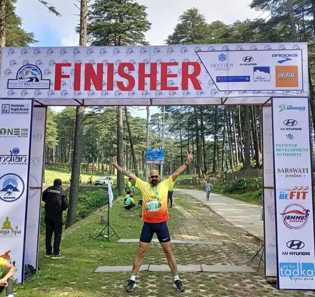 Patnitop Marathon 2027 – India's Most Beautiful Hill Race Now Has a 100K Ultra 2 Runners crossing the Patnitop Marathon finishing line at 2,024 metres, surrounded by Deodar forests in Jammu and Kashmir