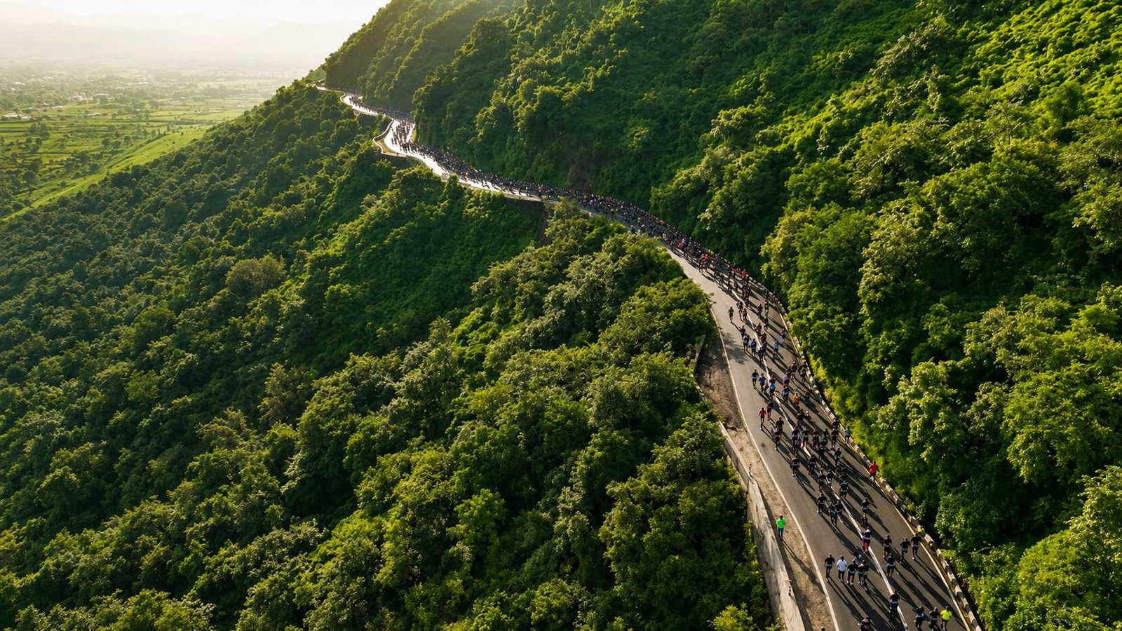 Runners tackling the scenic Satara Hill Half Marathon route through the lush Western Ghats in Maharashtra.