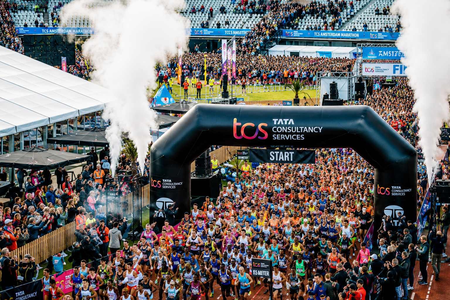 TCS Amsterdam Marathon 2026 race start at the historic Olympic Stadium — thousands of runners line up for Europe's fastest Platinum Label marathon