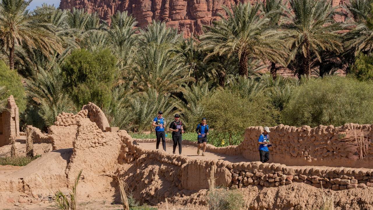 AlUla Trail Race 2027: The Ultimate Runner's Guide 2 Runners at the AlUla Trail Race moving through the desert canyon landscape of AlUla, Saudi Arabia