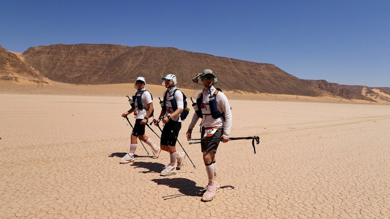 Runners crossing a sand dune in Wadi Rum during Ultra X Jordan 2026 — the 10th Anniversary Edition of the multi-day desert ultra marathon