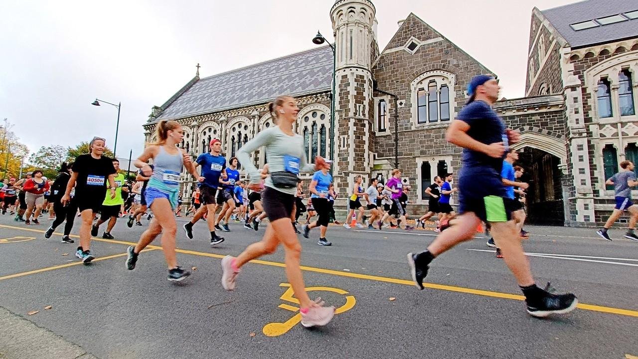 Runners competing in the ASICS Christchurch Marathon on the flat four-lap central city circuit through Christchurch, New Zealand