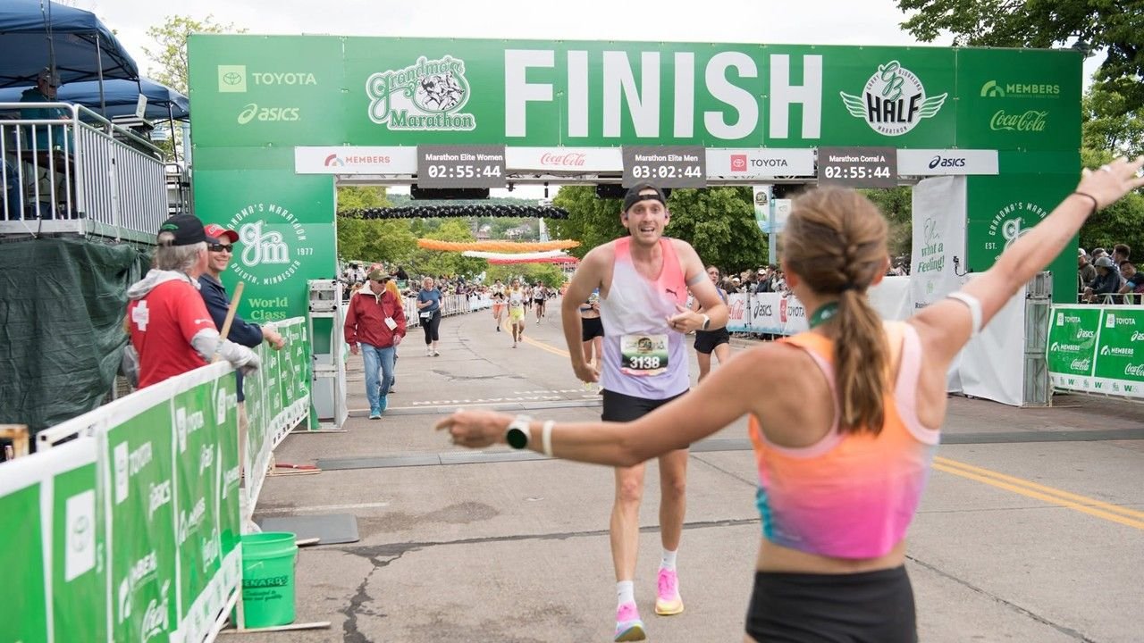 Runners celebrating at marathon finish line