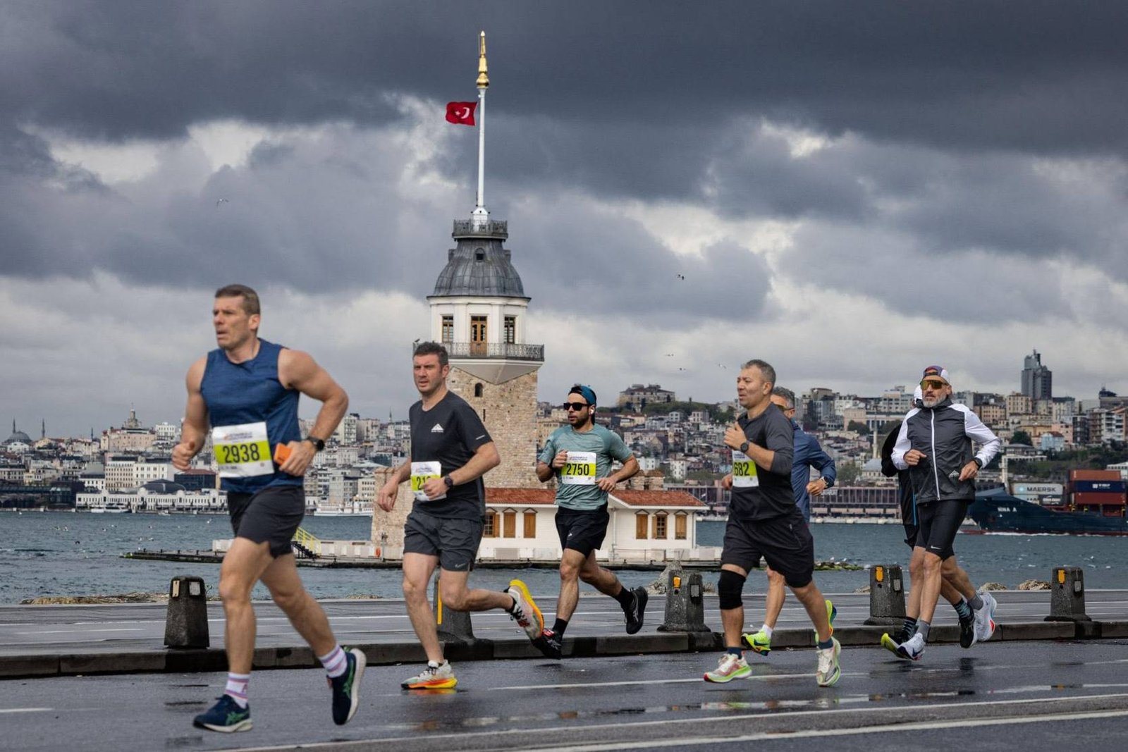 Runners crossing the 15 July Martyrs Bridge at the Istanbul Marathon, Bosphorus Strait visible in the background