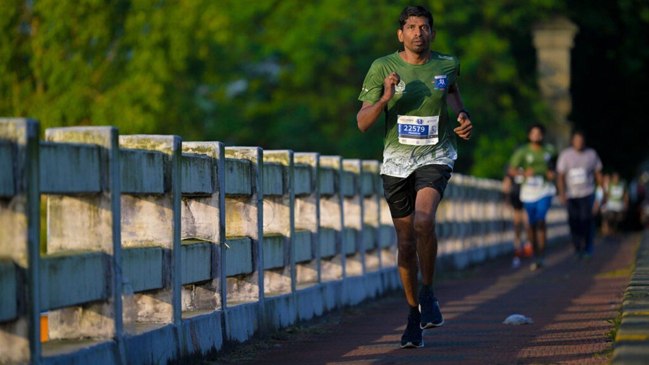 Kochi Spice Coast Marathon 2026 - Race Guide, Dates, Registration & Course 1 Runners on the flat coastal course at the Kochi Spice Coast Marathon, organised by Soles of Cochin Running Club, Kerala