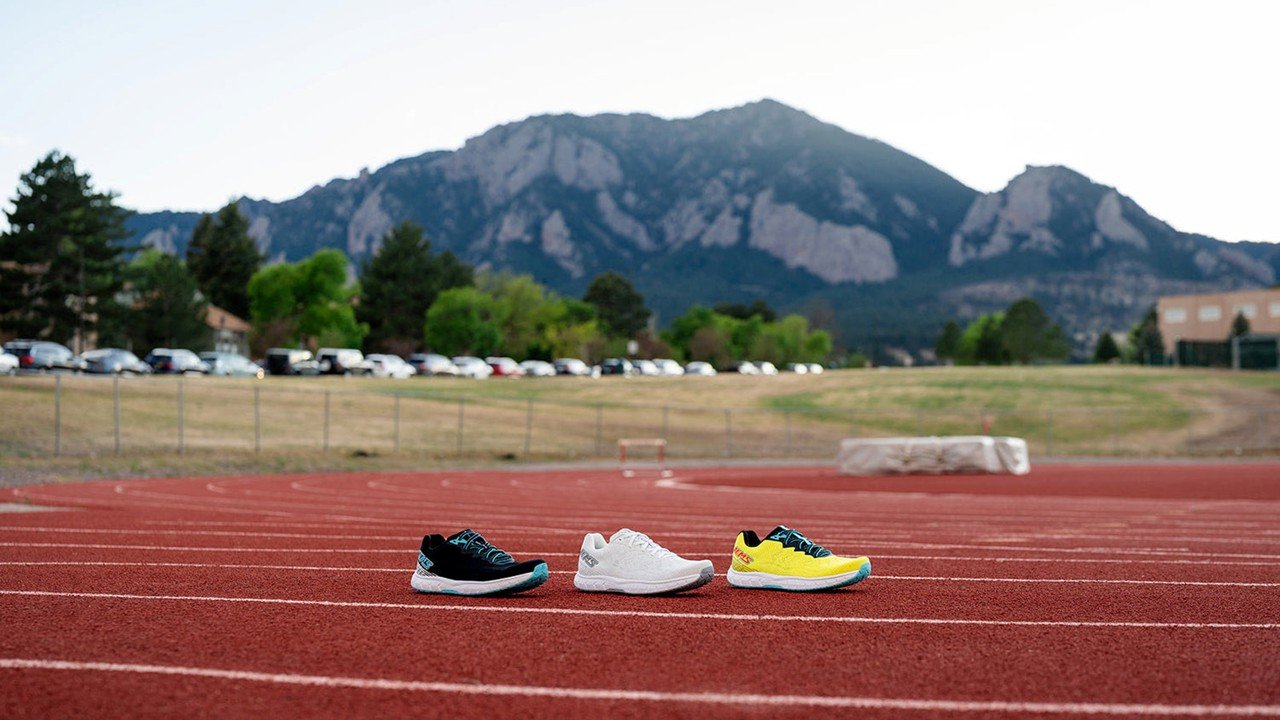 Three pairs of running shoes displayed