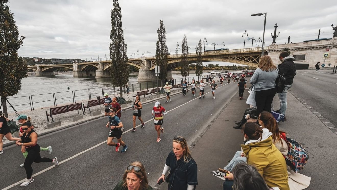 Runner on the Danube embankment during the SPAR Budapest Marathon with the Hungarian Parliament in the background