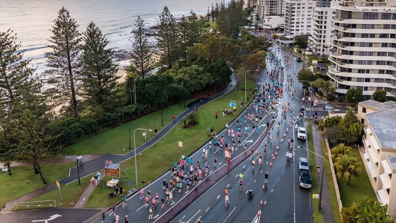 Runners racing along the coastal route at the EVA Air Sunshine Coast Marathon, Alexandra Headland Queensland