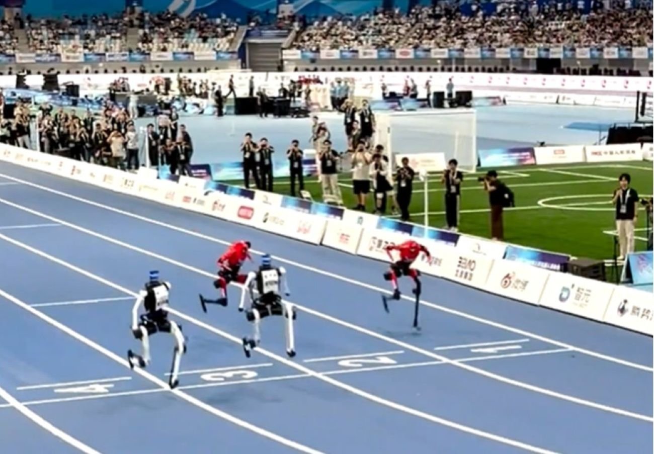 Humanoid robots race in the 100m large-group final at the 2nd World Humanoid Robot Games, National Speed Skating Oval, Beijing, August 26 2026