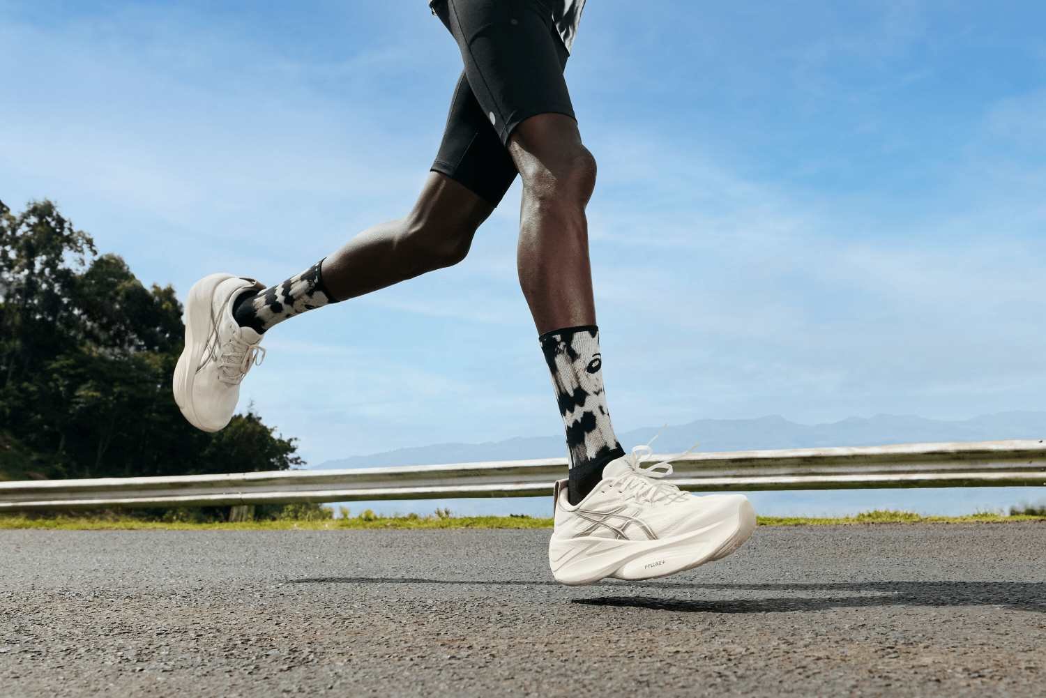 ASICS GEL-SLOWCUSH running shoe in cream white colourway mid-stride on open road, showing FF LUXE PLUS midsole stack