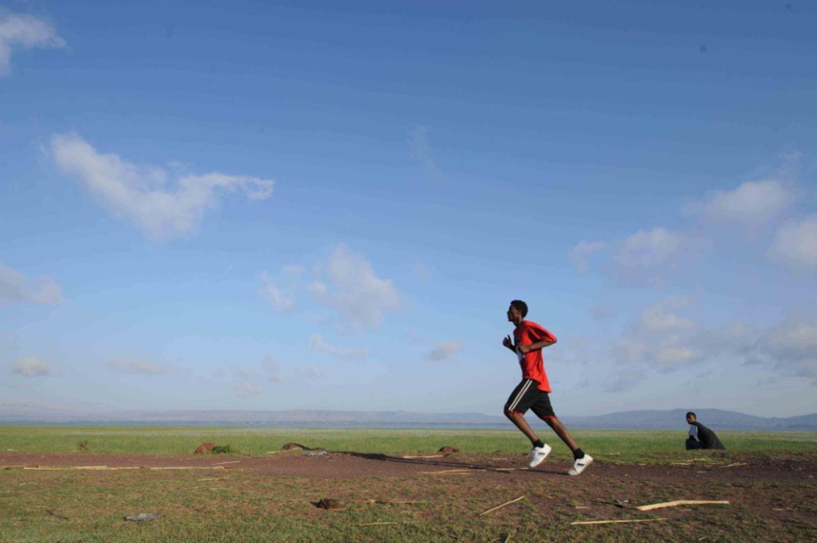 Ethiopian runner competing at the Great Ethiopian Run across open highland terrain