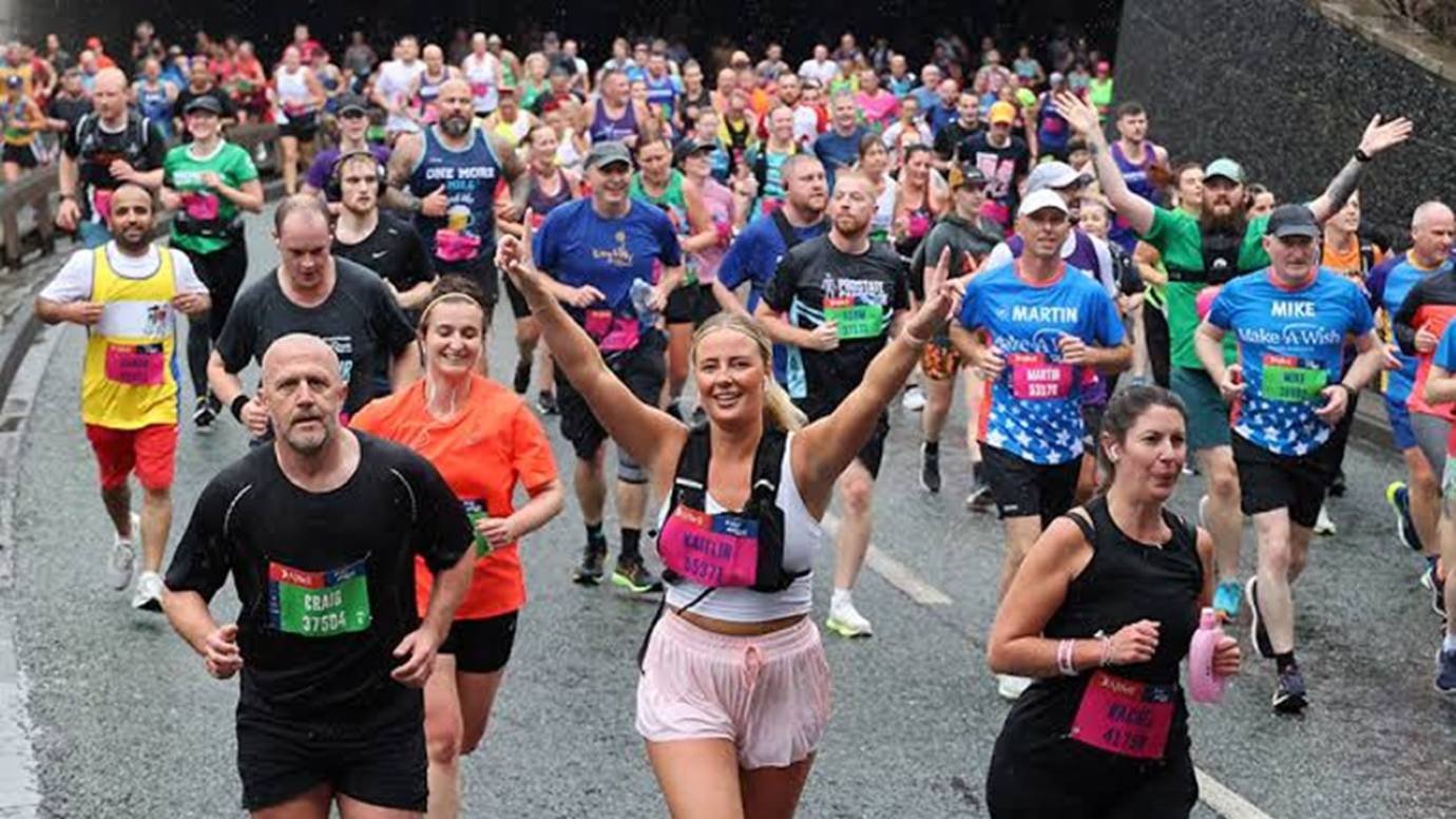 Mass participation runners passing through a tunnel underpass in the opening miles of the AJ Bell Great North Run in Newcastle