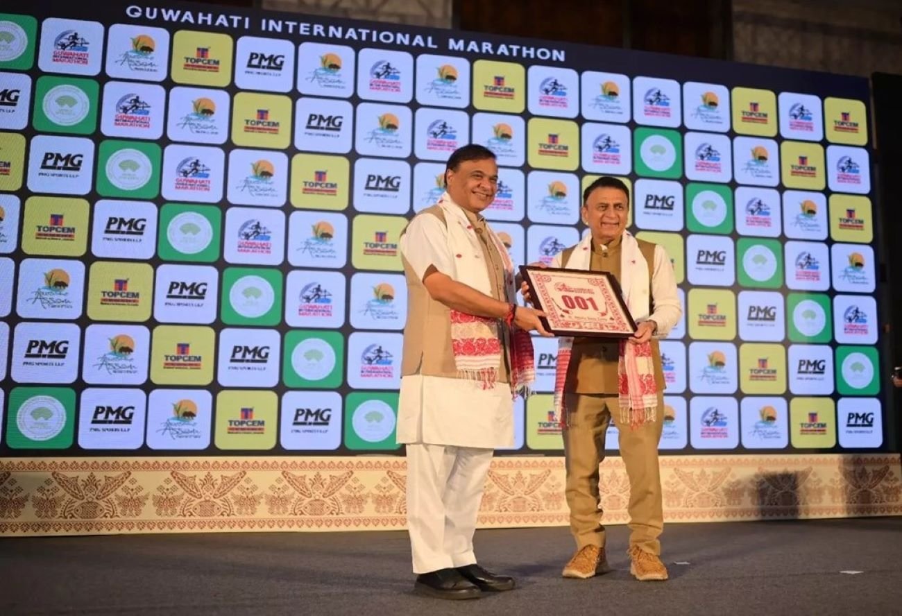 Guwahati International Marathon 2027 Announced: Rs 1.25 Crore Prize Purse, Route Map and Key Dates 1 Sunil Gavaskar presenting the first registration jersey to Assam Chief Minister Himanta Biswa Sarma at the Guwahati International Marathon 2027 launch event