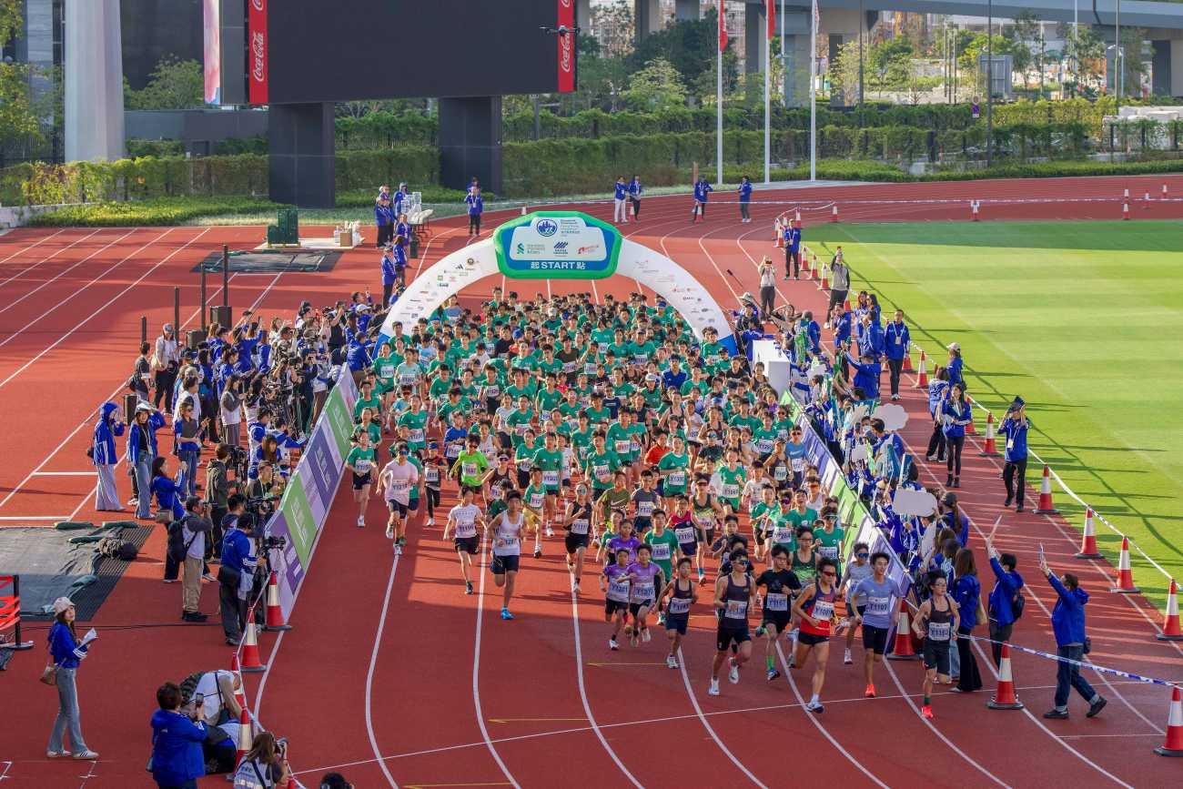 SCHKM 2027: Record 78,000 Quota, a New 5km Harbourfront Run and the September 11 Ballot 2 Runners crossing the start line at the SCHKM Youth Run at Kai Tak Sports Park, Hong Kong