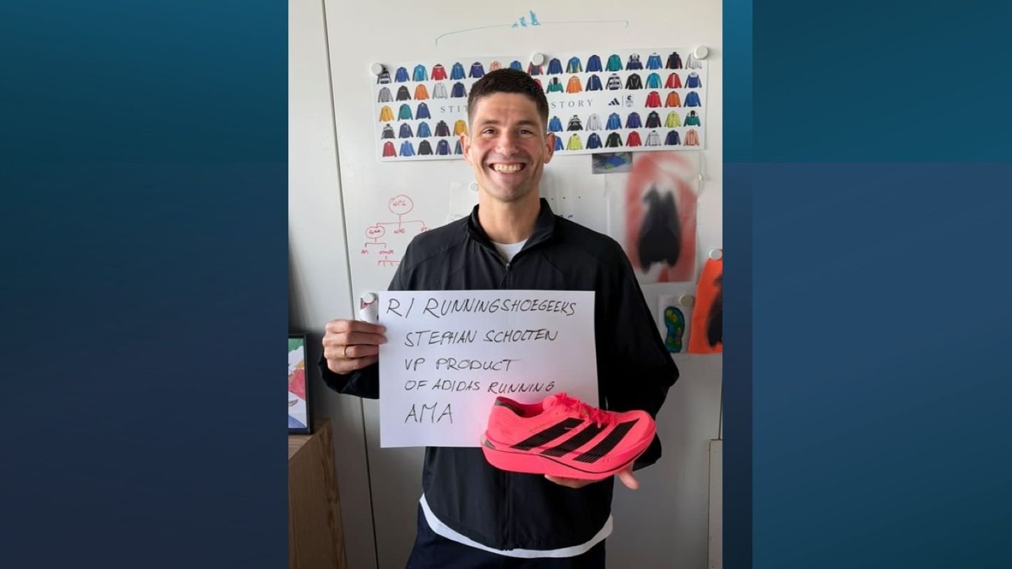 Stephan Scholten, VP of Product for Running at Adidas, holds a handwritten AMA sign and the Adizero Adios Pro 5 during a Reddit AMA on r/RunningShoeGeeks