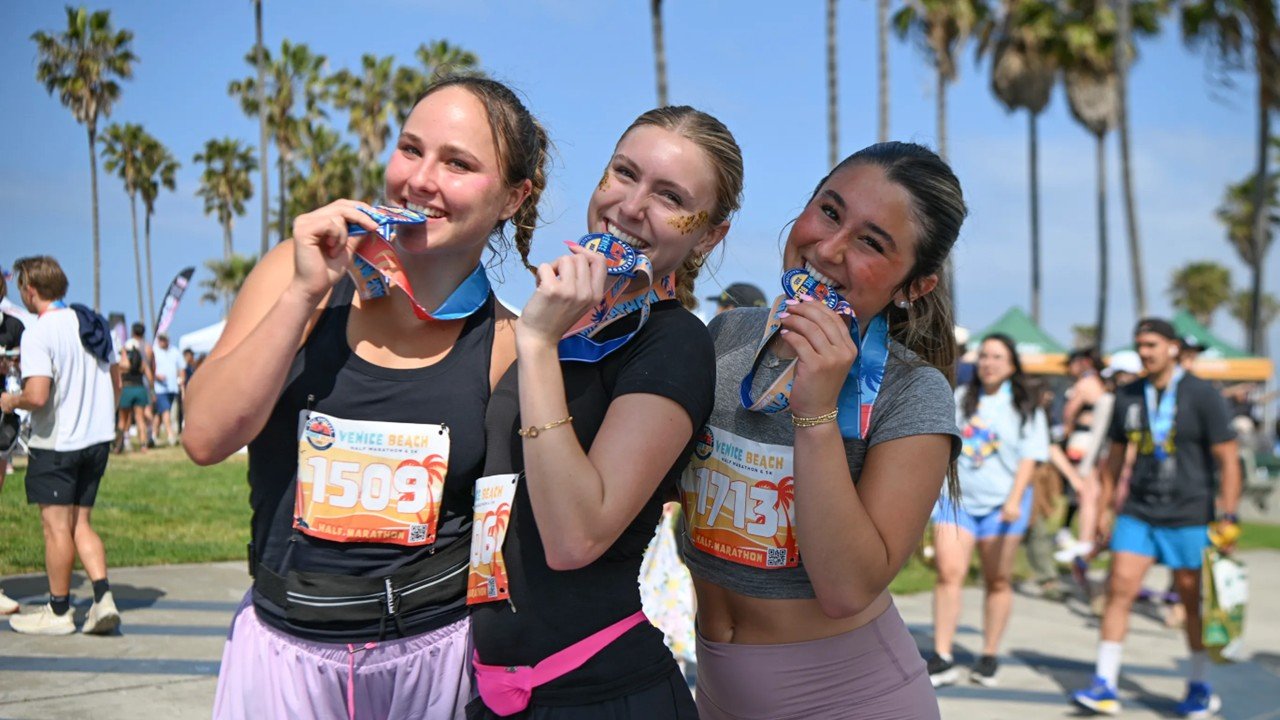 Runners competing in the Venice Beach Half Marathon on Ocean Front Walk, Venice Beach, California