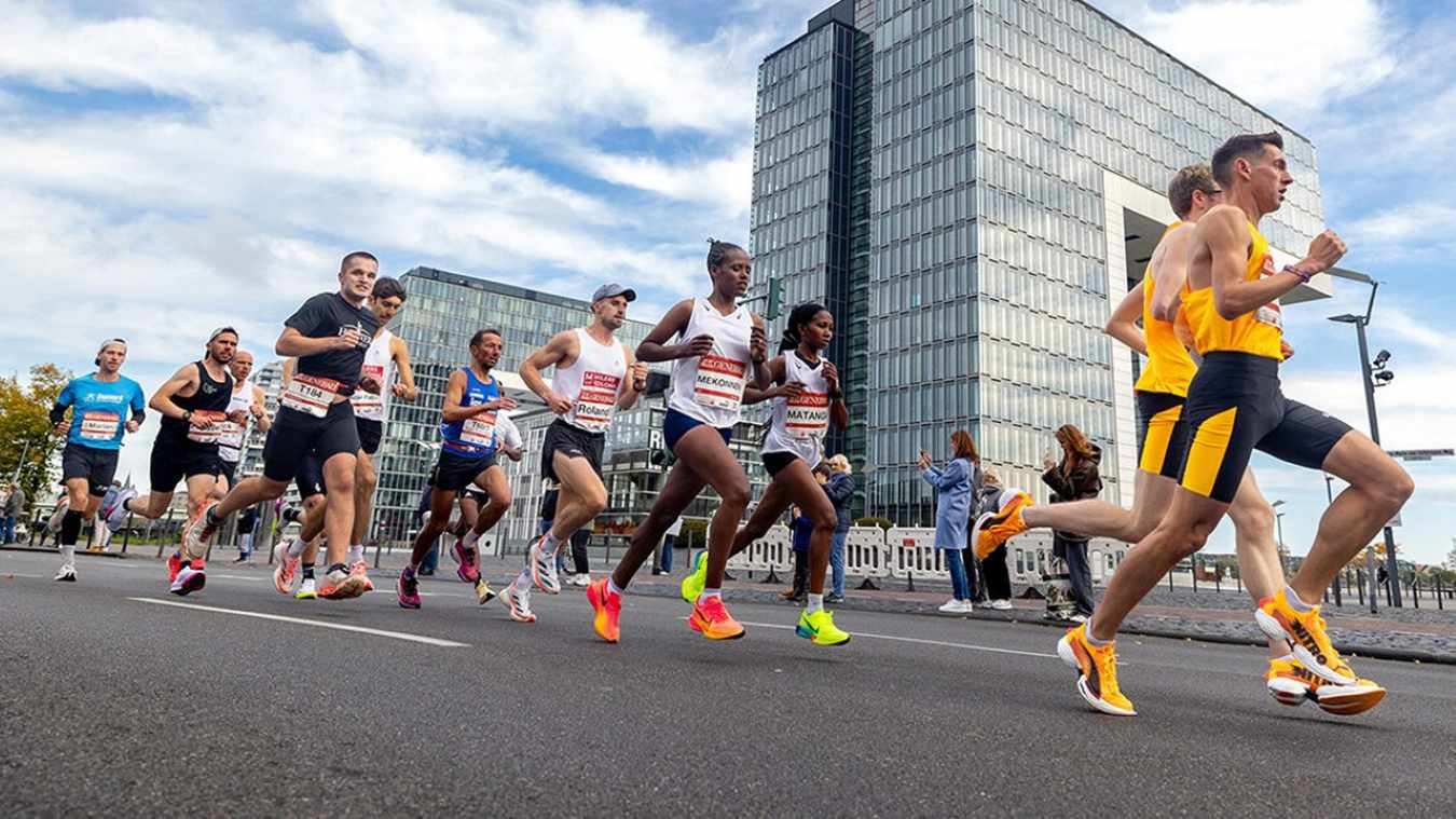 Elite and mass runners competing in the 2026 Generali Cologne Marathon on the streets of Cologne, Germany