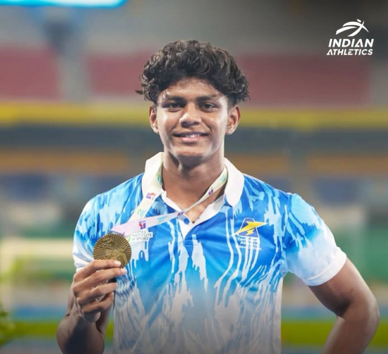 Neil Samraj R of Tamil Nadu holds his gold medal after breaking the U18 Boys 100m national record with a time of 10.45 seconds at the 41st National Junior Athletics Championships in Chennai