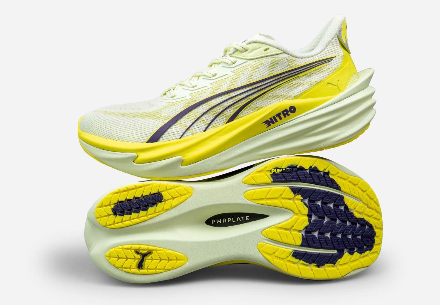 Puma Deviate Nitro 4 running shoe in yellow and white colourway showing the carbon composite PWRPLATE outsole and PumaGrip rubber lugs