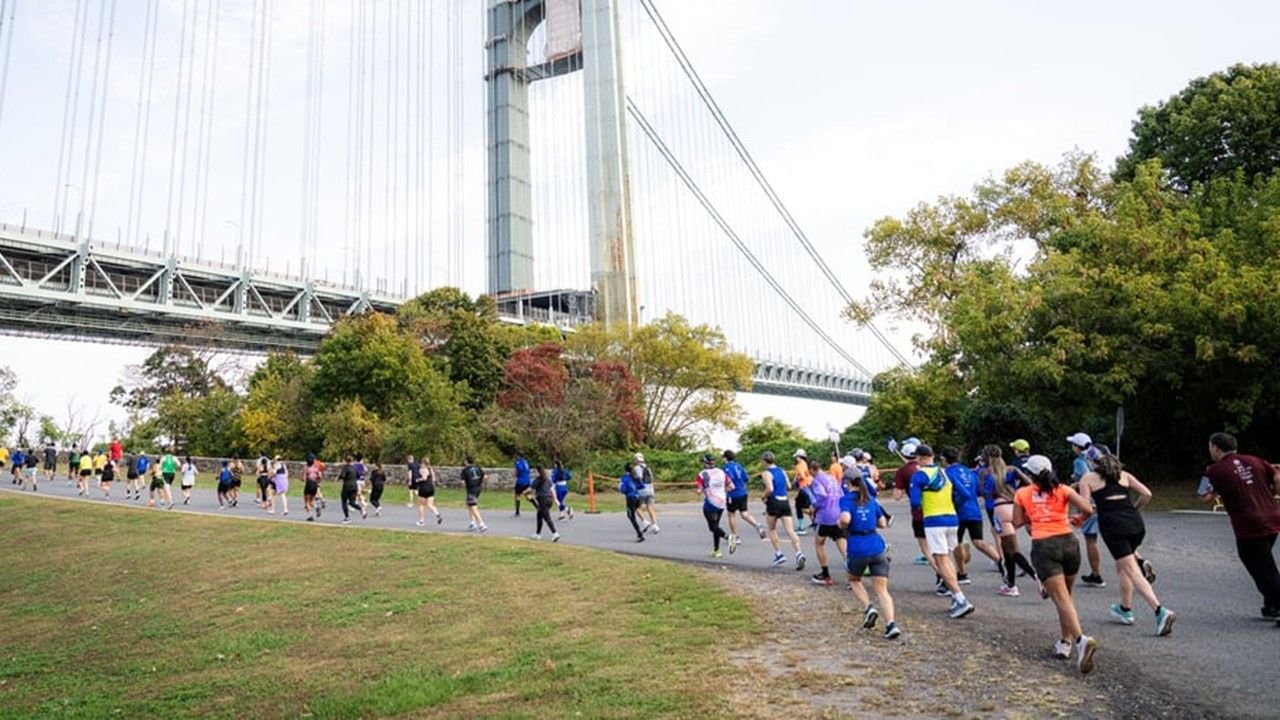 Runners passing under the Verrazzano-Narrows Bridge at the start of the TCS New York City Marathon 2026 in Staten Island
